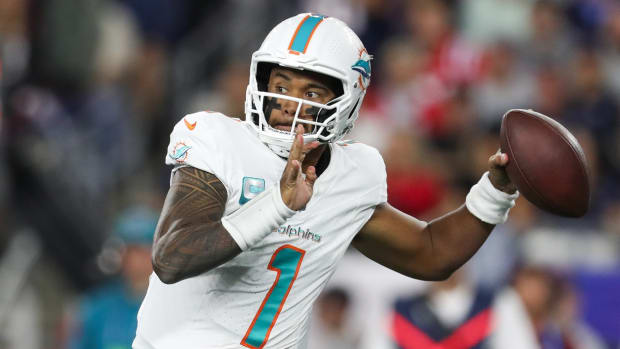 Miami Dolphins quarterback Tua Tagovailoa (1) passes the ball during the first half against the New England Patriots at Gillette Stadium.
